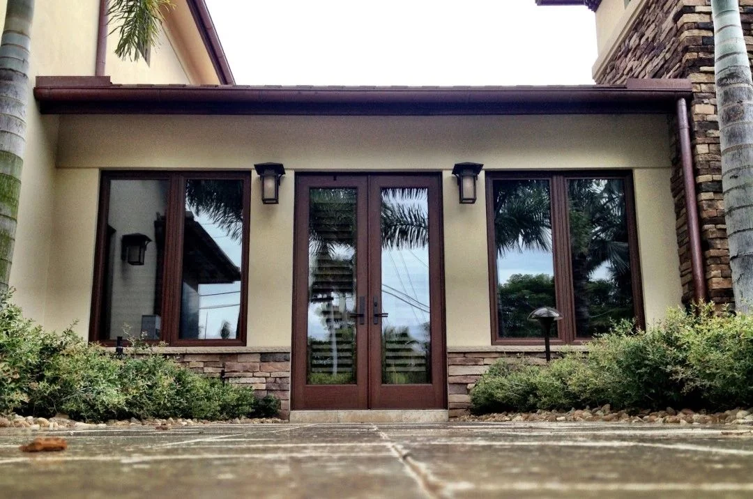 Impact French doors and side windows on a South Florida home