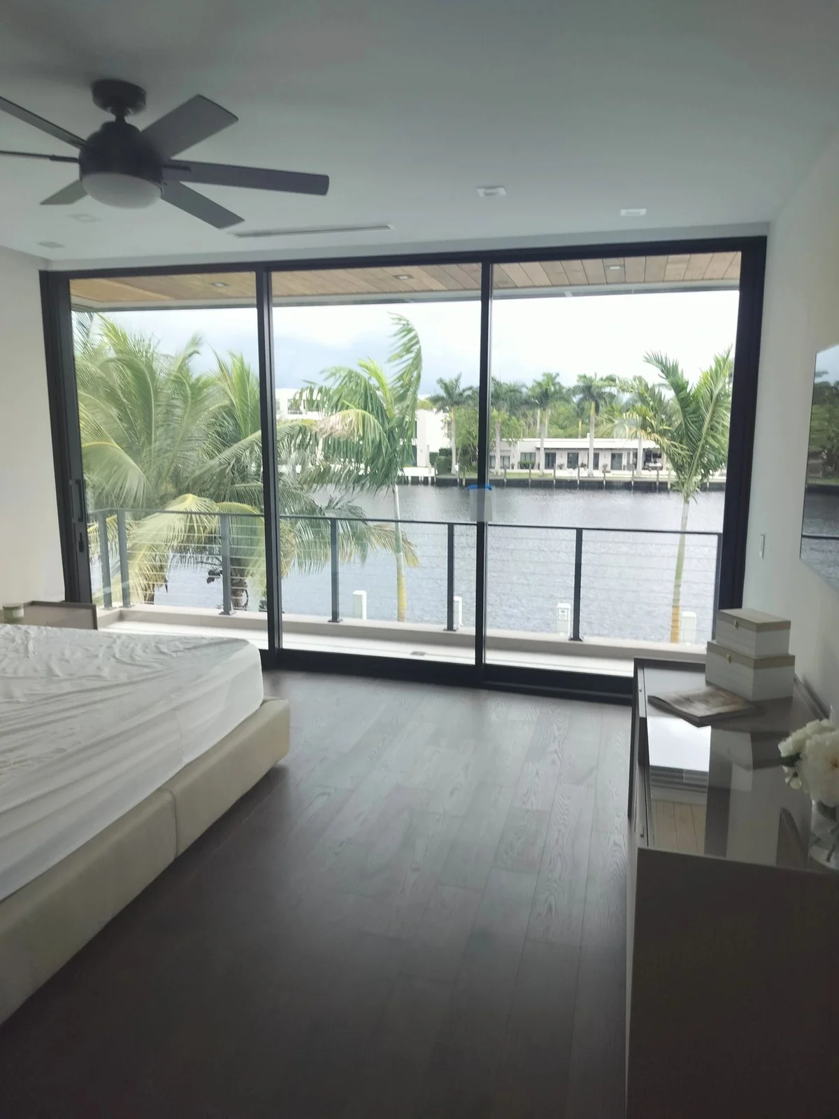 Floor to ceiling impact sliders overlooking a Fort Lauderdale waterway